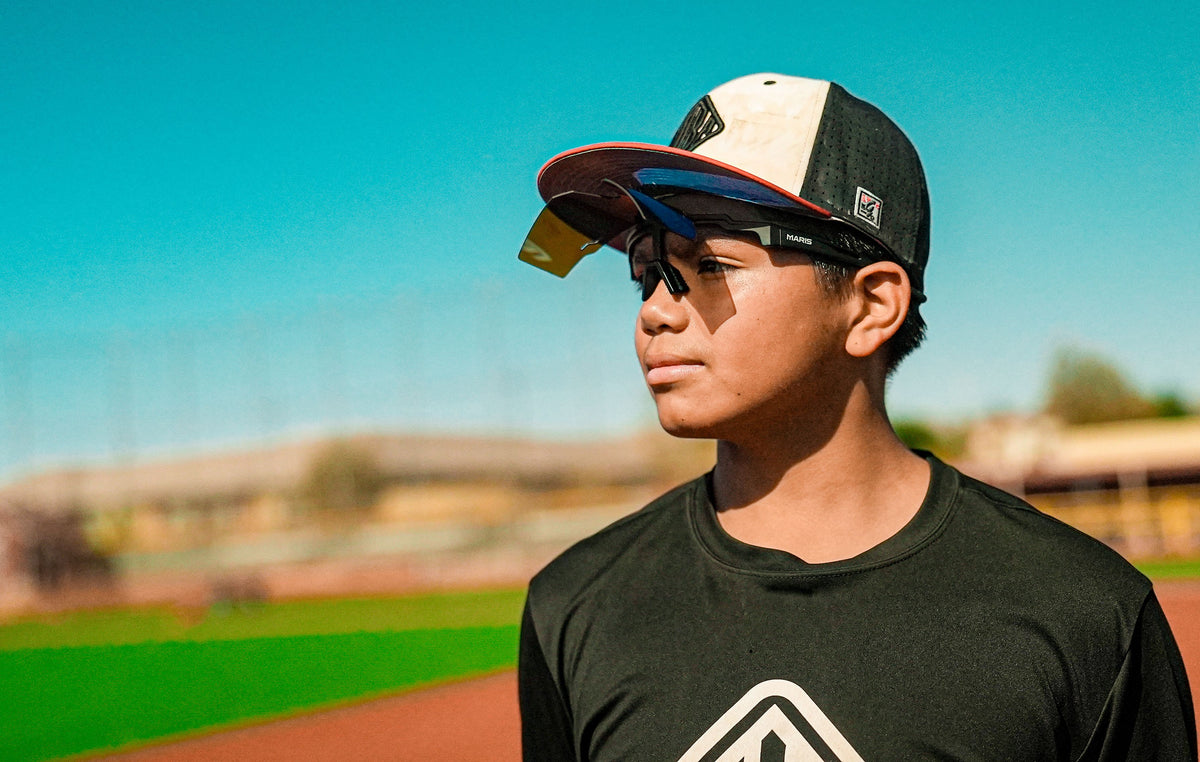 Baseball player wearing Maris Optics flip-up baseball sunglasses on the field