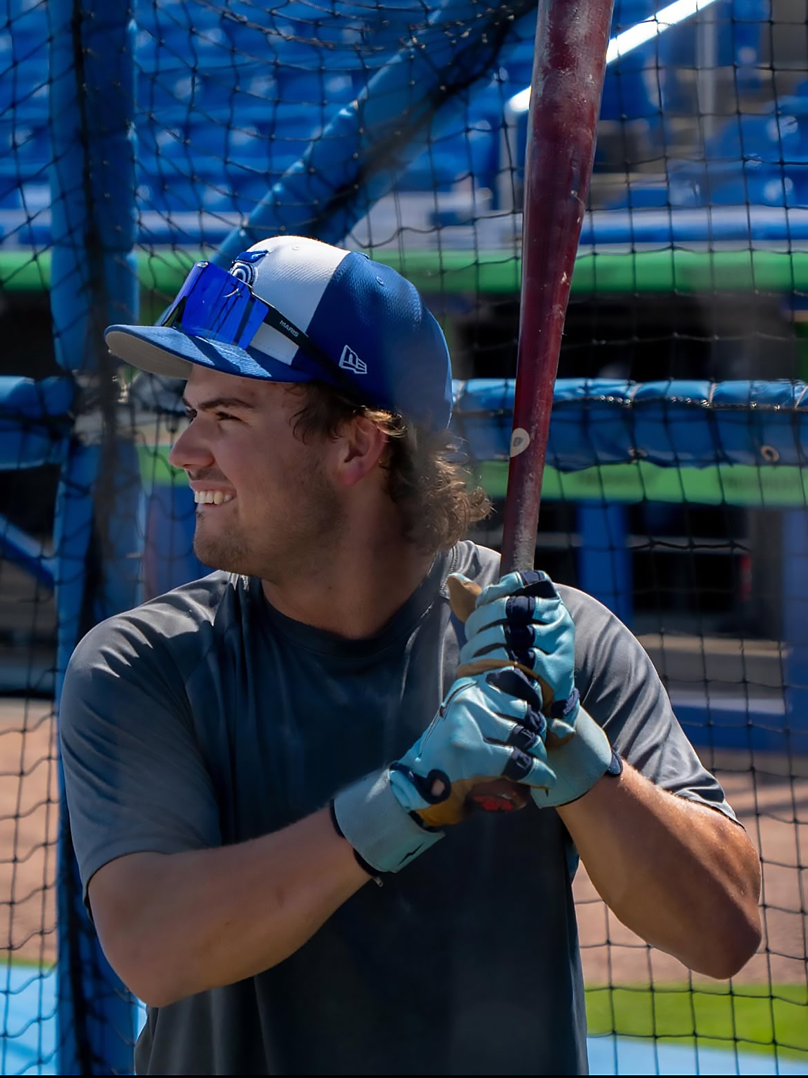 Baseball player wearing Maris Optics flip-up baseball sunglasses on the field